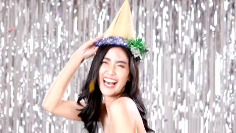 Asian-woman-dancing-with-attractive-smile-at-party-event.-People-with-party,-celebration,-new-year-concept.