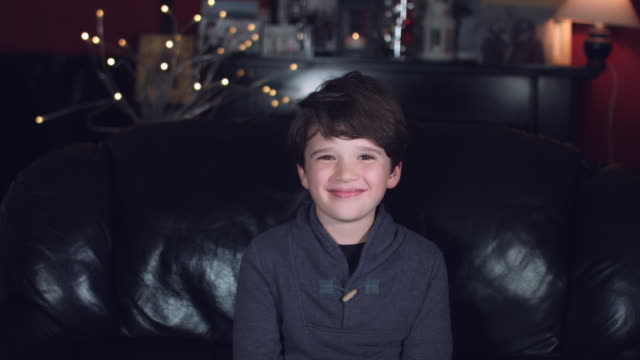 4k-Authentic-Shot-of-a-Cheerful-Child-Posing-on-Couch