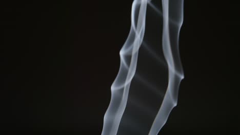 SLOW-MOTION:-Changing-smoke-curves-on-a-black-background