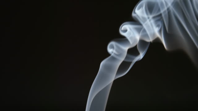 SLOW-MOTION:-Elegant-line-of-smoke-on-a-black-background