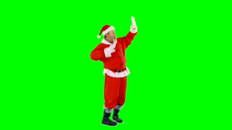 Santa-Claus-tanzen-vor-grünem-Hintergrund