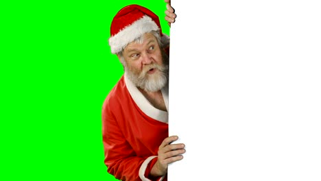 Sorpresa-de-Papá-Noel-esconderse-detrás-de-pantalla-verde
