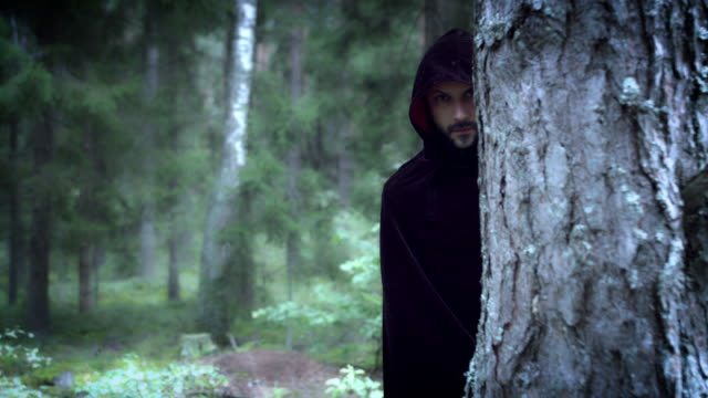 4K-Halloween-Horror-Man-Hiding-in-Woods-with-Black-Cape