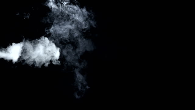 Smoke-billowing-over-a-black-background.