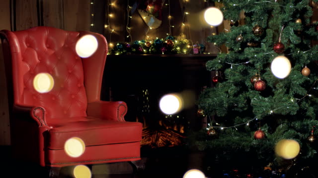 Christmas-interior-fireplace.-Santa-Claus-chair-near-Christmas-tree.-4K.