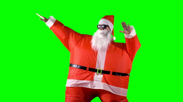 Santa-Claus-en-danzas-de-colores-sobre-un-fondo-verde.