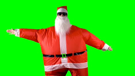 Santa-Claus-macht-Arm-Welle-tanzen-bewegt-sich-auf-einem-grünen-Hintergrund.