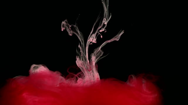 Pintura-tinta-roja-en-el-agua-creando-formas-artísticas-líquidos