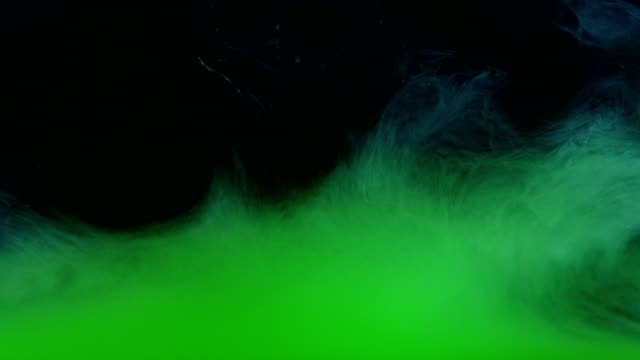 Green-Ink-Colors-in-Water-Creating-Liquid-Art-Shapes