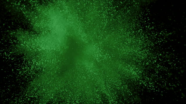 Polvo-verde-explotando-sobre-fondo-negro-en-camara-super-lenta