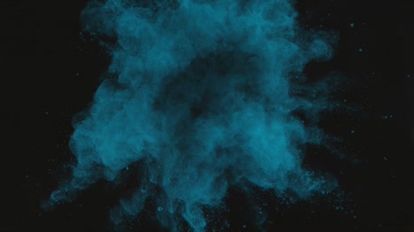 Polvo-verde-azul-explosión-sobre-fondo-negro-en-camara-super-lenta