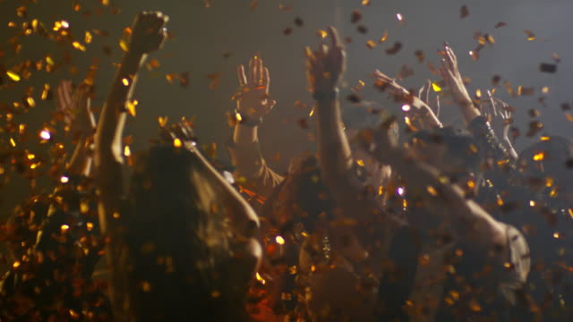 Joyful-Crowd-Dancing-in-Confetti-Shower