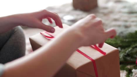 Woman's-hands-preparing-christmas-presents