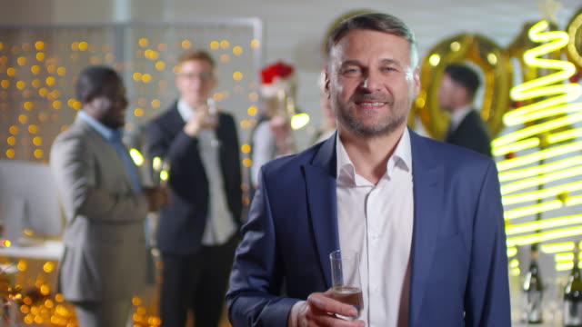Businessman-Posing-at-New-Year-Party-in-Office