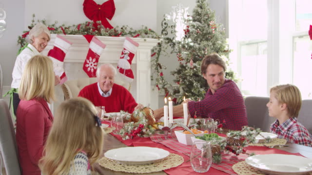 Grandmother-Brings-Out-Turkey-At-Christmas-Meal-Shot-On-R3D