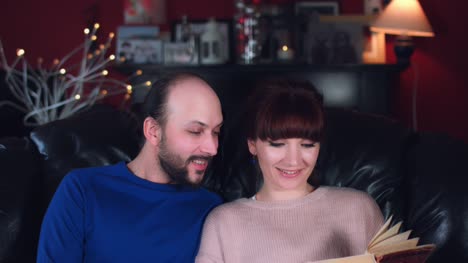 4k-Authentic-Shot-of-a-Couple-Reading-a-Book-on-Couch