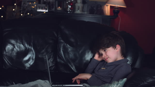 4k-Authentic-Shot-of-a-Boy-Looking-at-Laptop