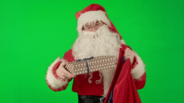 Santa-Claus-Packaging-Gifts-on-a-Green-Screen-Chrome-Key
