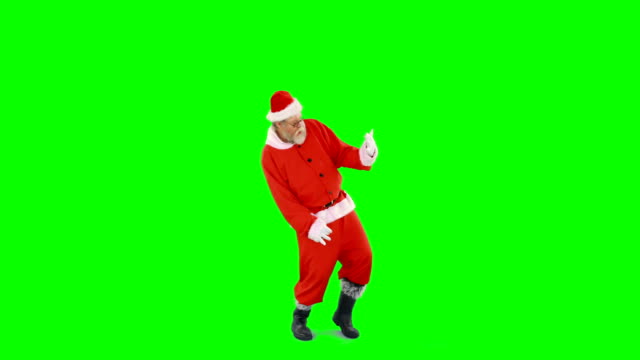 Santa-claus-dancing-against-green-background