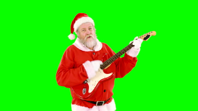 Santa-claus-cantando-una-canción-y-tocando-la-guitarra