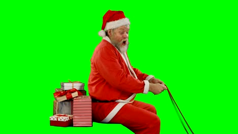Weihnachtsmann-mit-Geschenk-Box,-Reiten-auf-green-screen