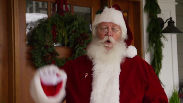 Santa-Claus-waving-by-front-door