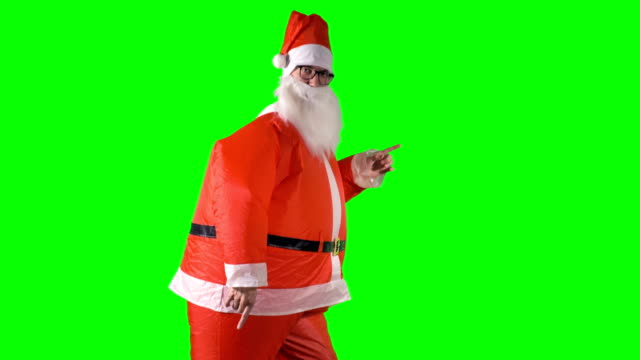 Santa-Claus-makes-robot-moves-with-his-hands-on-green-background.