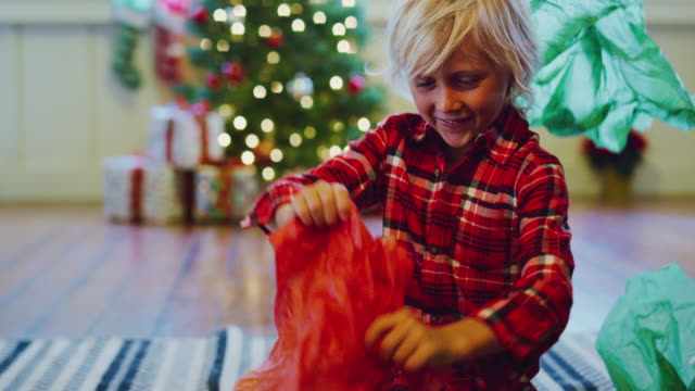 Young-Boy-Opening-Christmas-Presents