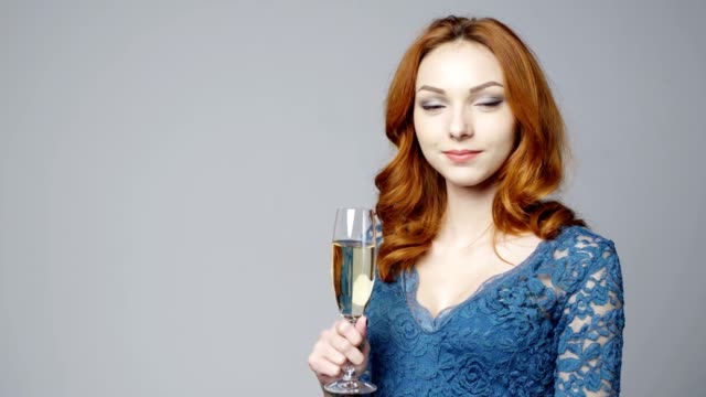 Female-in-lace-dress-with-glass-of-champagne