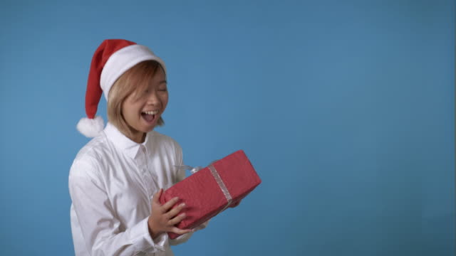 beautiful-girl-like-santa-holding-red-box-with-present