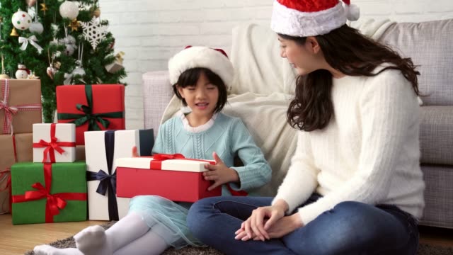 mother-gives-her-little-daughter-presents