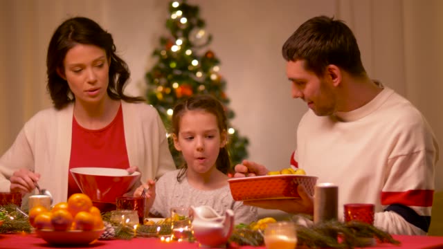 happy-family-having-christmas-dinner-at-home