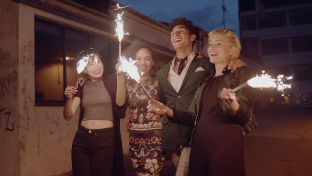 Young-people-celebrating-new-years-eve-with-sparklers