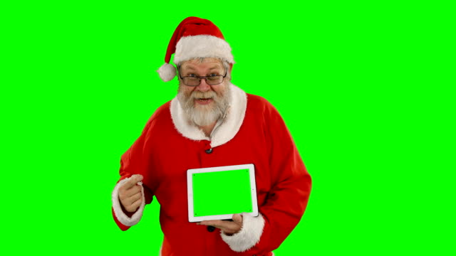 Santa-claus-holding-digital-tablet-