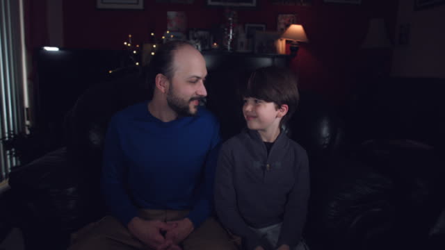 4k-Authentic-Shot-of-a-Dad-and-his-Son-Smiling-Together