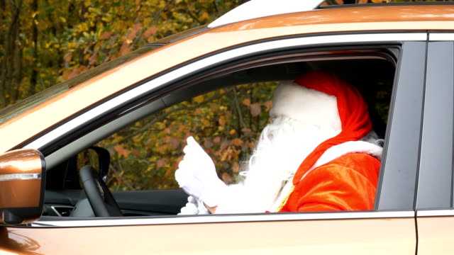 Santa-dances-while-sitting-in-the-car-side-view-50-fps