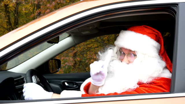 Santa-gives-a-gift-while-sitting-in-the-car-50-fps