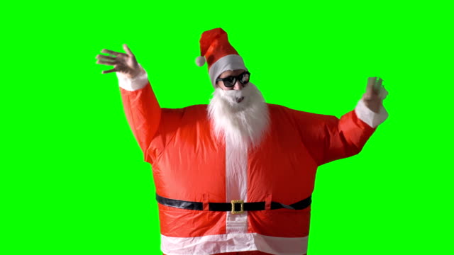 Santa-Claus-waves-to-the-camera-with-both-hands.