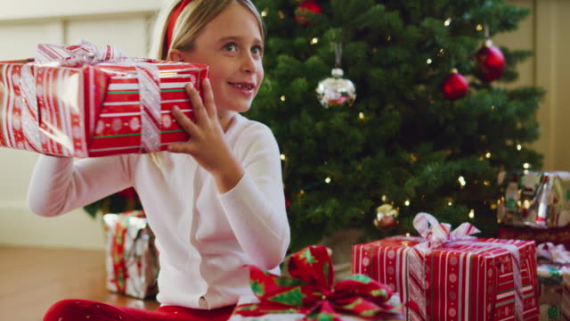 Young-Girl-Opening-Christmas-Presents