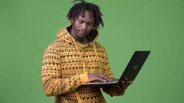 Young-handsome-African-man-using-laptop
