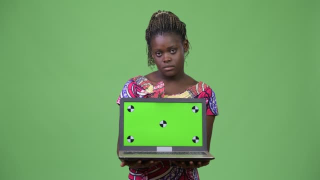 Young-African-woman-showing-laptop