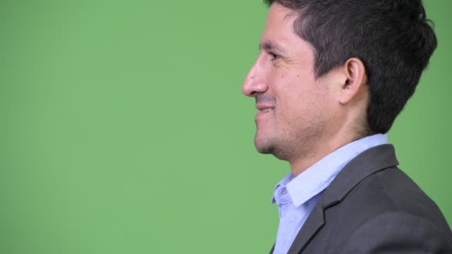Headshot-profile-view-of-Hispanic-businessman-smiling