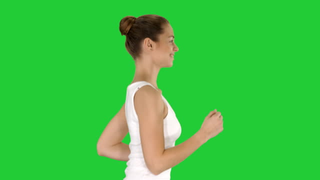 Fit-young-woman-running-on-a-Green-Screen,-Chroma-Key