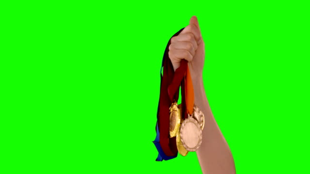 Hand-holding-medals