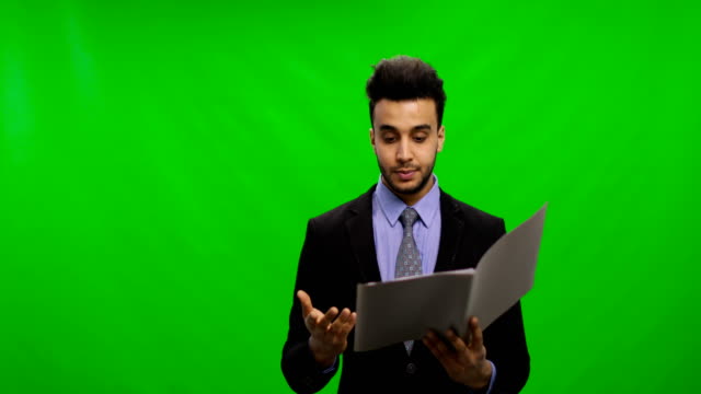 Serious-Businessman-Read-Documents-Over-Chroma-Key-Green-Screen-Hold-Reports-Pensive-Having-Problem