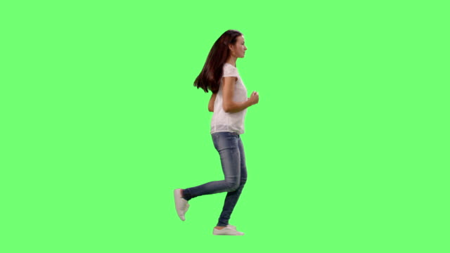 Fit-Young-Girls-Wearing-Casual-Clothes-Running-on-a-Mock-up-Green-Screen.
