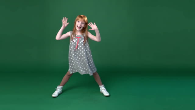 Cute-little-ginger-girl-playing--the-ape-and-fooling-around
