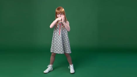 Cute-little-ginger-girl-playing--the-ape-and-fooling