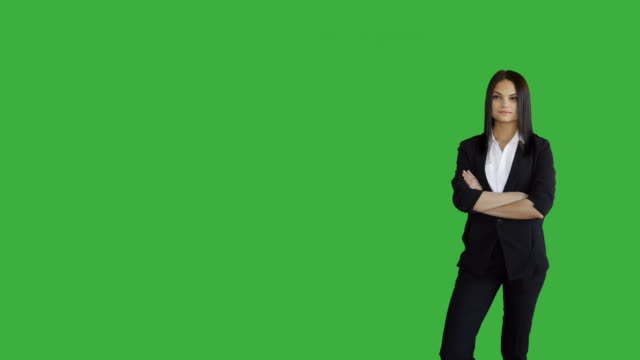 Young-Attractive-Brunette-Women-Standing-Isolated-Against-Green-Screen-Background.-Portrait-of-Beautiful-Professional-Female-Person-in-Suit