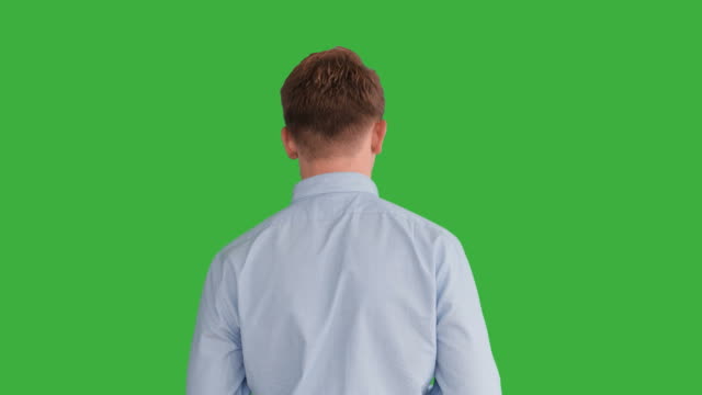 Young-Caucasian-Man-Standing-against-Green-Screen-Background.-Male-Person-Isolated-on-Chroma-Key.-Casual-Business-Professional-Portrait